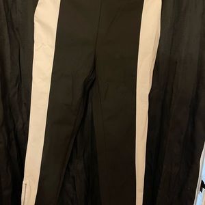 Black and white pants with zipper at the ankles. Size 12 from H&M